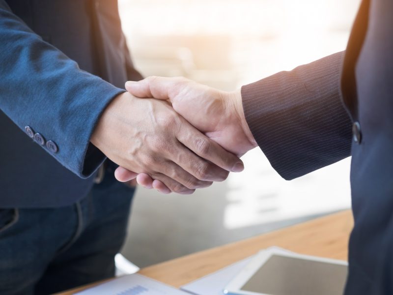 two-confident-business-man-shaking-hands-meeting-office-success-dealing-greeting-partner-concept